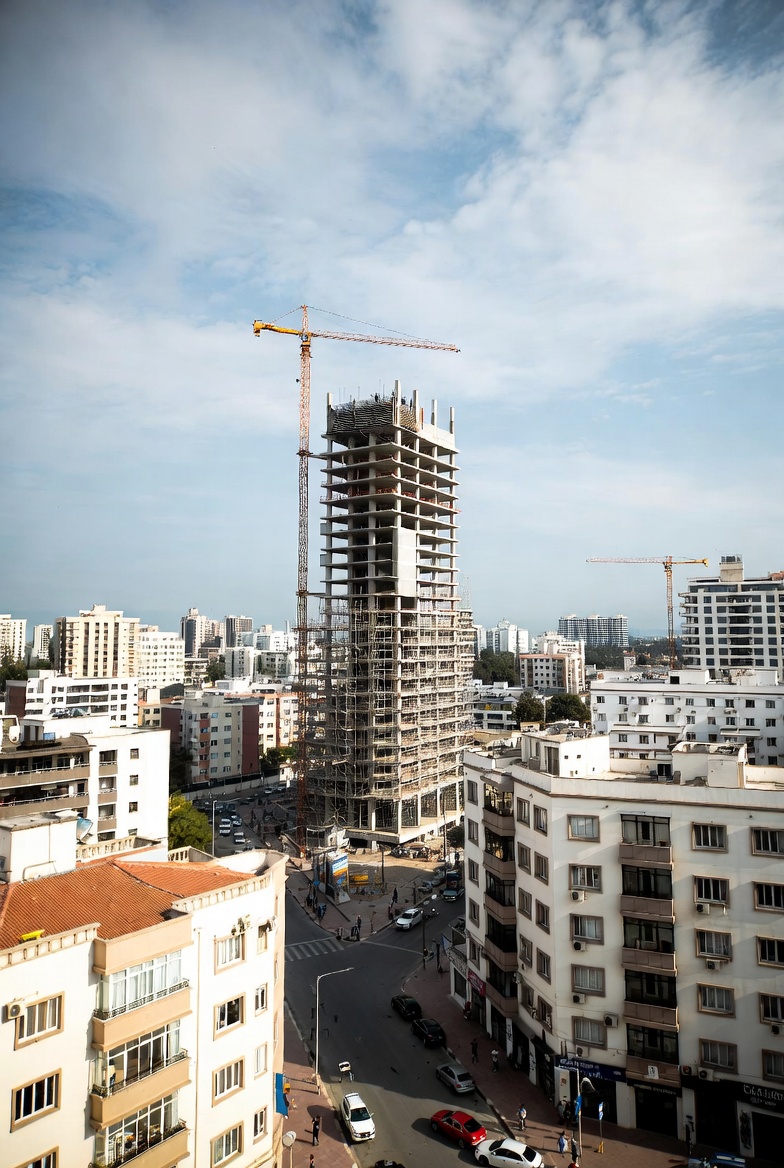 Building under construction much taller than surrounding area